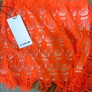 Laundry room skirt orange buttons on the back